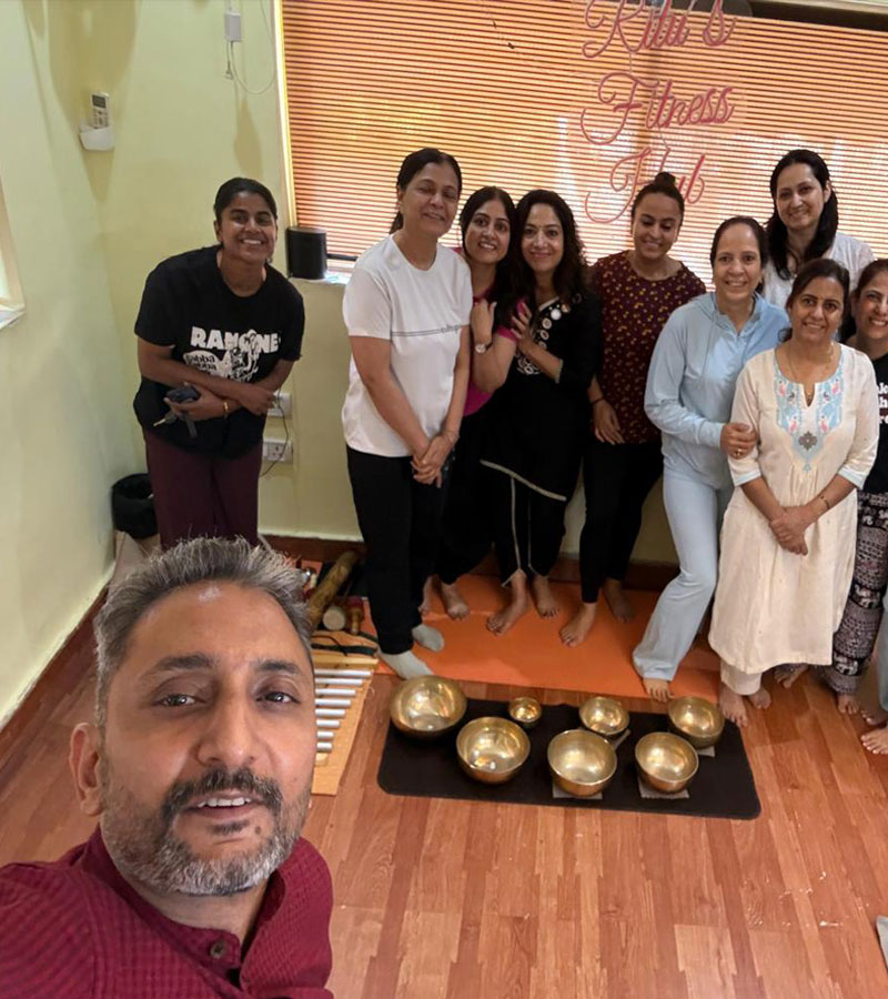 Sound healing practitioner conducting a singing bowl therapy session Sound healing practitioner conducting a singing bowl therapy session